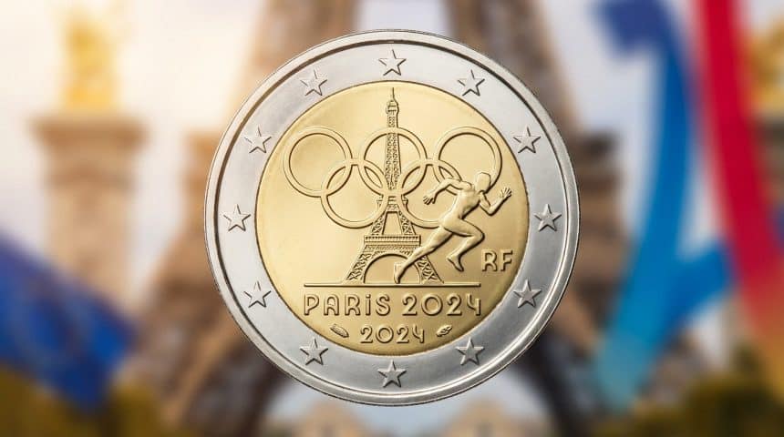 Detailed 2 euro coin for Paris 2024 Olympics, with Eiffel Tower, Olympic rings, athlete, and "PARIS 2024". Blurred background.